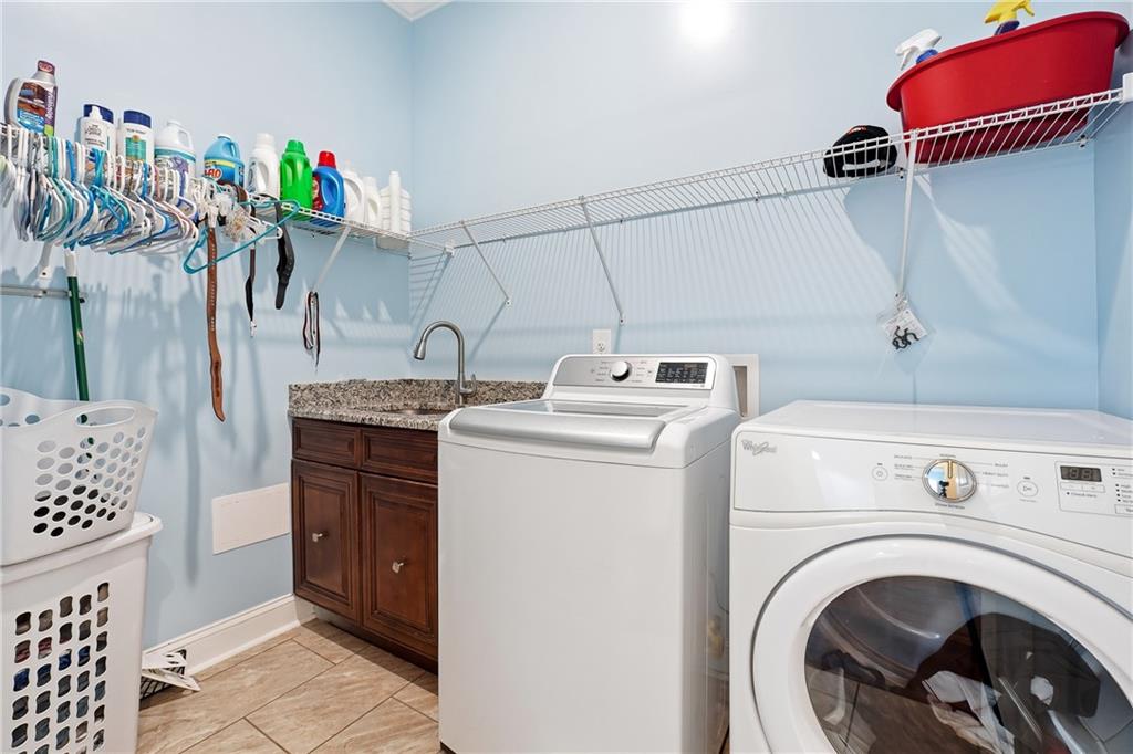 100 Marshas Vineyard Hampton, GA 30228 - Photo 44 of 71 a utility room with dryer and washer
