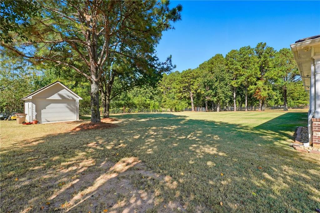 100 Marshas Vineyard Hampton, GA 30228 - Photo 48 of 71 a view of a house with yard and tree s