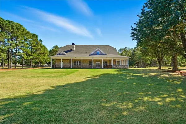 an aerial view of a house with a lake view