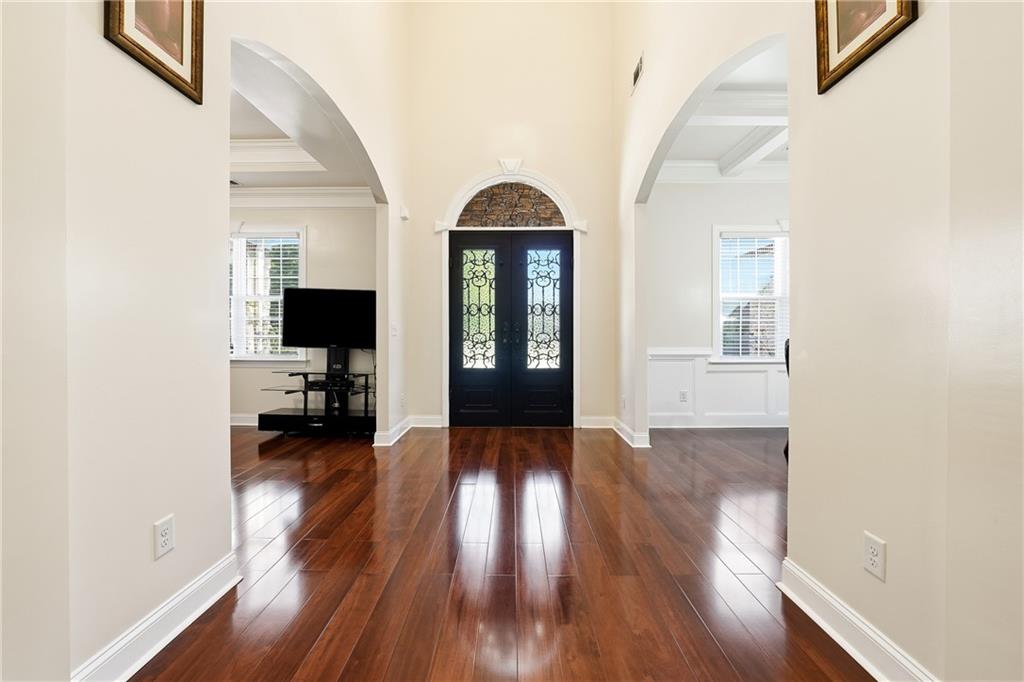 100 Marshas Vineyard Hampton, GA 30228 - Photo 8 of 71 wooden floor in a hall with a window and wooden floor