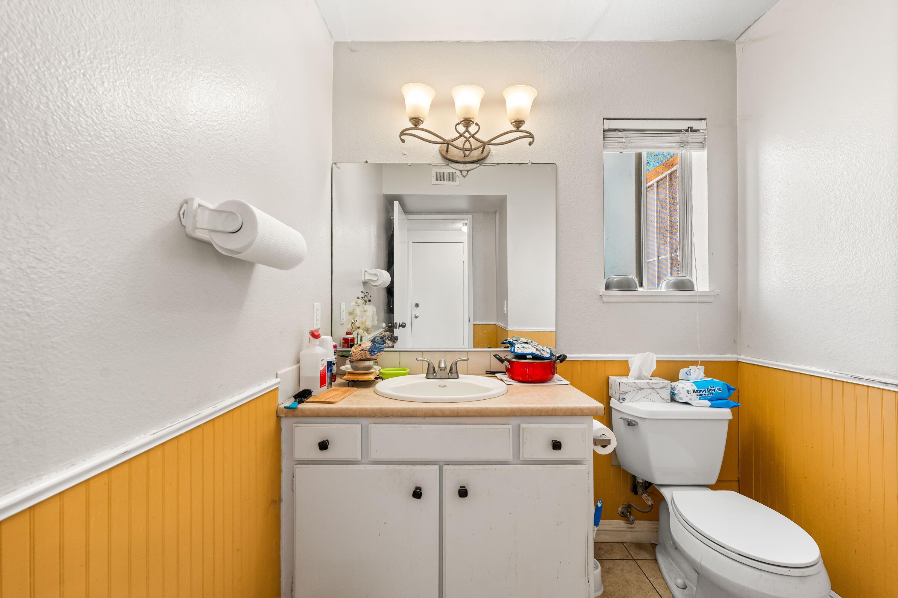 37826 Cardiff Street Palmdale, CA 93550 - Photo 13 of 22 a bathroom with a sink vanity mirror and toilet