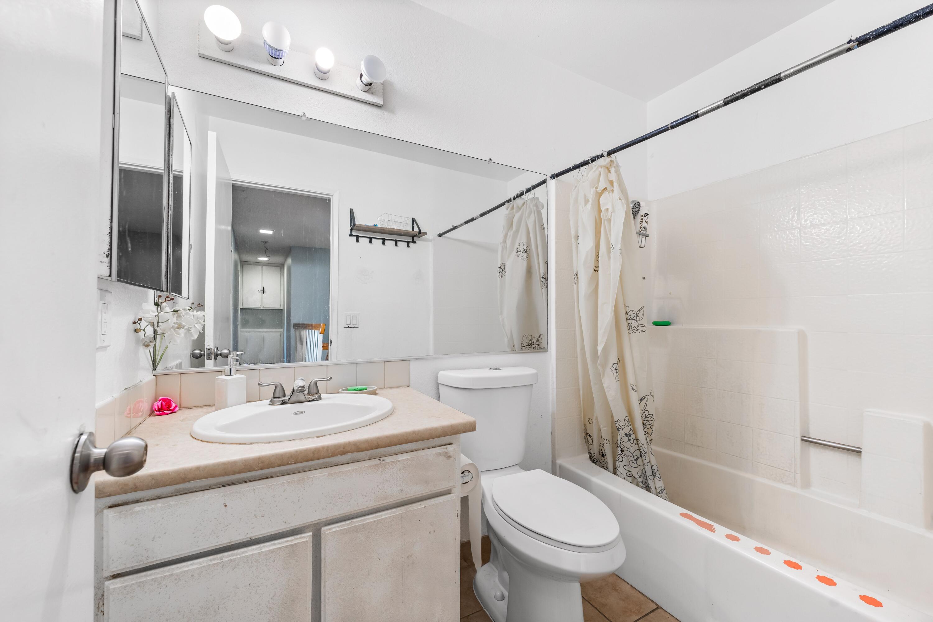 37826 Cardiff Street Palmdale, CA 93550 - Photo 18 of 22 a bathroom with a sink toilet tub and shower