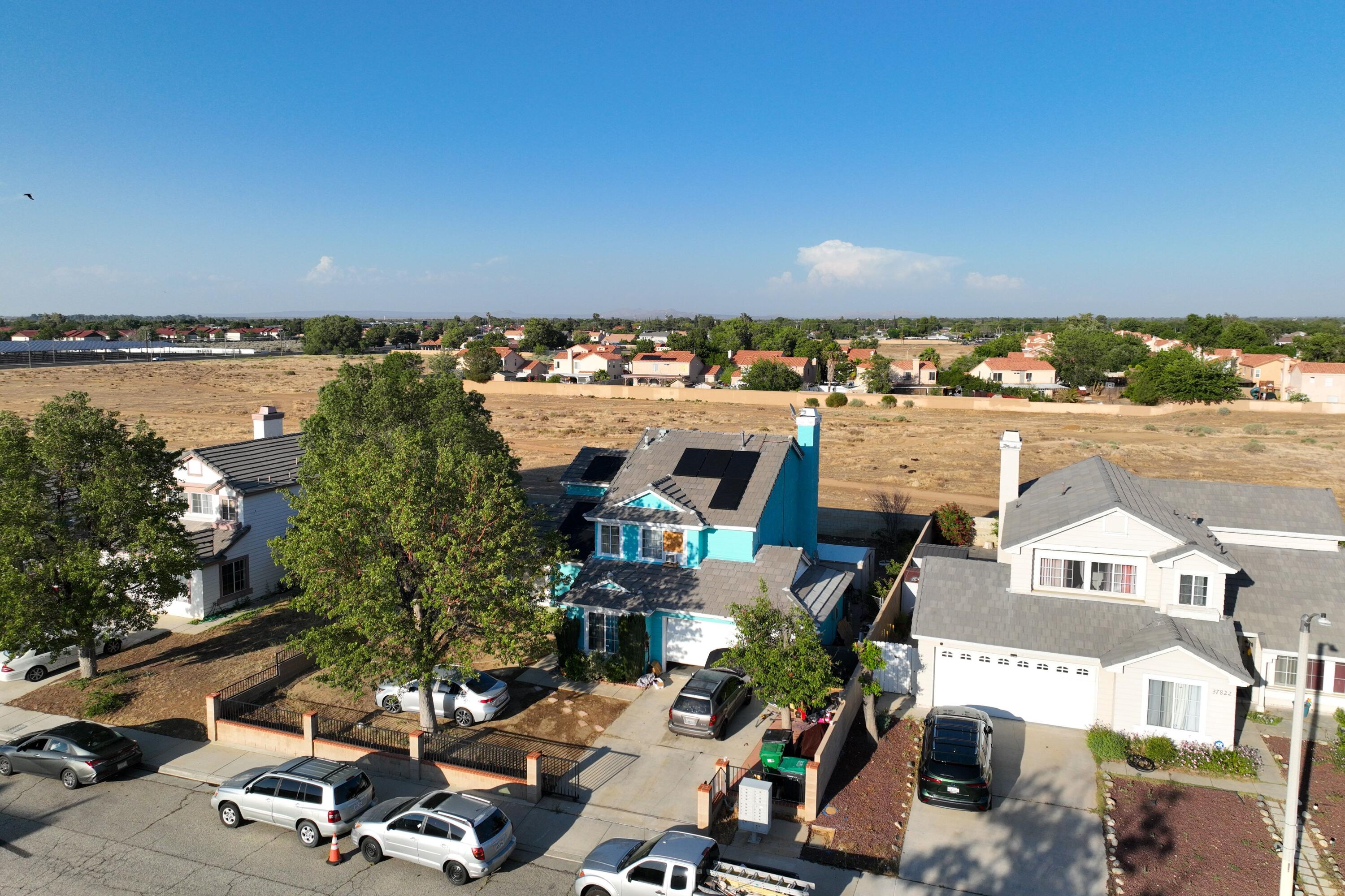 37826 Cardiff Street Palmdale, CA 93550 - Photo 21 of 22 an aerial view of residential houses with outdoor space