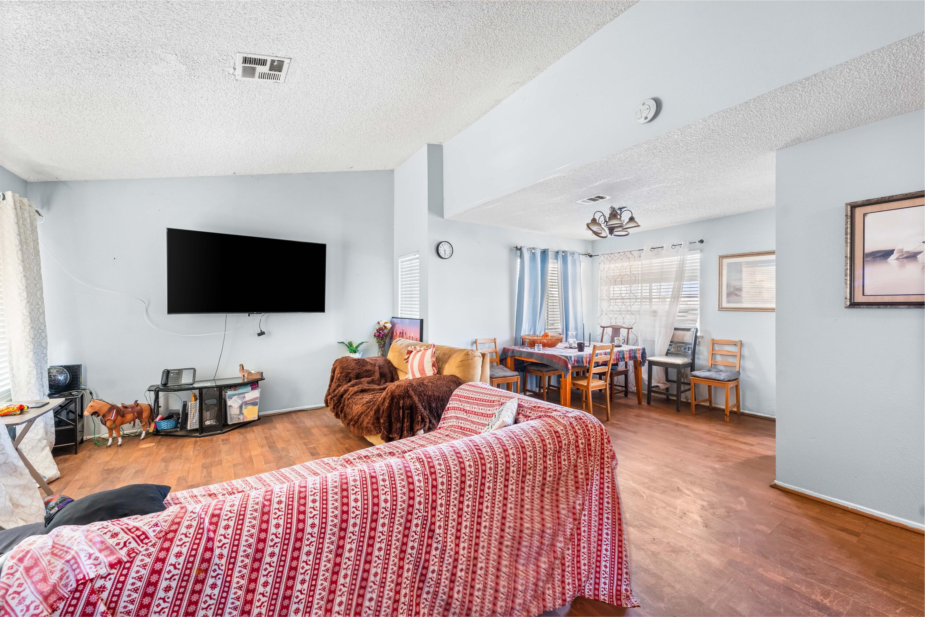 37826 Cardiff Street Palmdale, CA 93550 - Photo 4 of 22 a bedroom with furniture and a flat screen tv