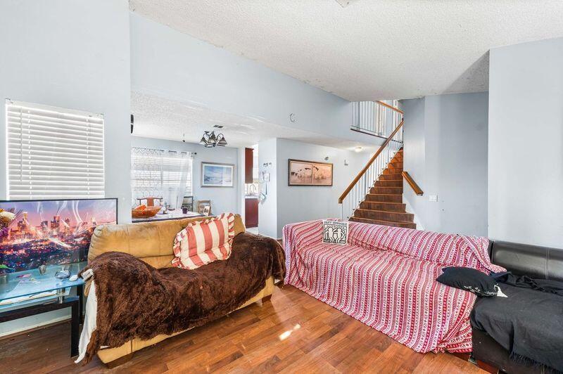 37826 Cardiff Street Palmdale, CA 93550 - Photo 5 of 22 a living room with a bed and a couch