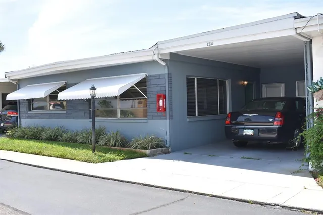 a view of a car parked in front of a house