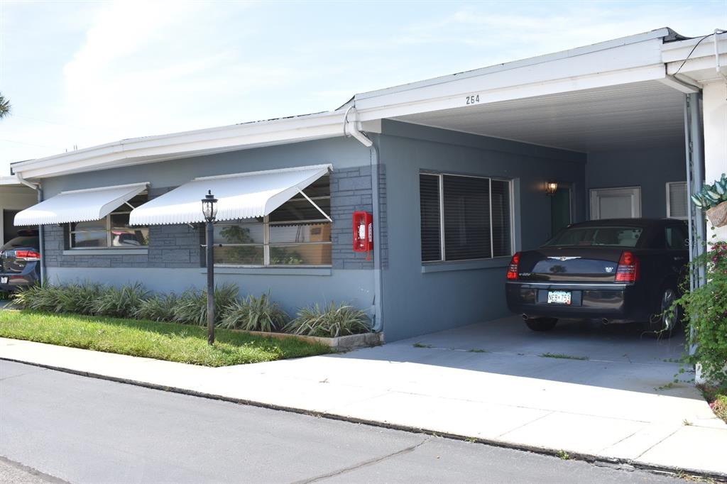 a view of a car parked in front of a house