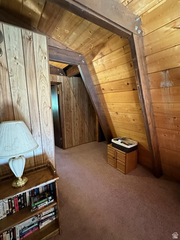 1456 Navajo Road Coalville, UT 84017 - Photo 38 of 55 Additional living space with wooden walls, carpet, and wood ceiling