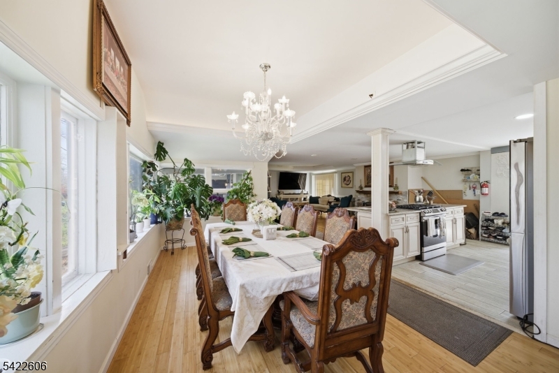399 Springbrook Trail Sparta, NJ 07871 - Photo 10 of 27 a view of a dining room with furniture and a chandelier