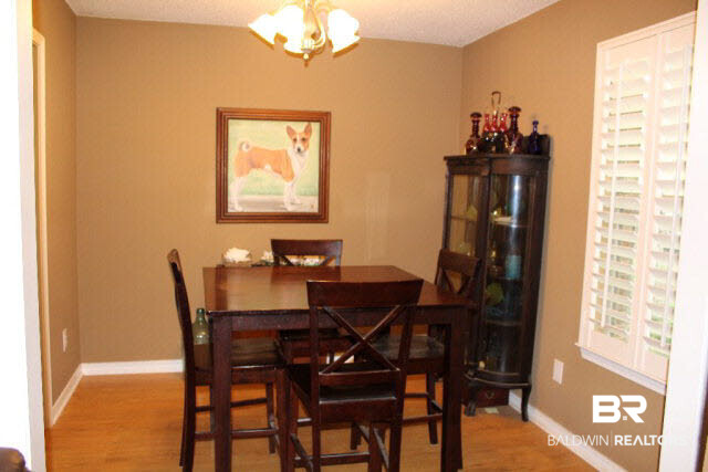 10375 Russ Road Daphne, AL 36526 - Photo 6 of 25 Area for formal dining, note the custom plantation shutters throughout most of the house