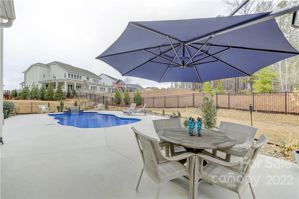 1912 Masons Bend Drive Fort Mill, SC 29708 - Photo 30 of 32 a view of an outdoor space with furniture and umbrella