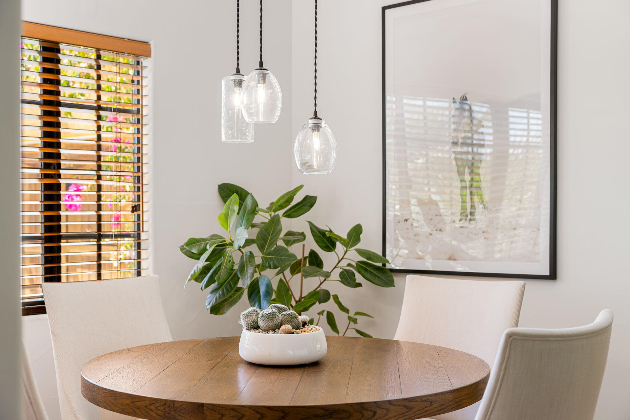 71429 Mirage Road Rancho Mirage, CA 92270 - Photo 29 of 65 a view of a dining room with furniture and a potted plant