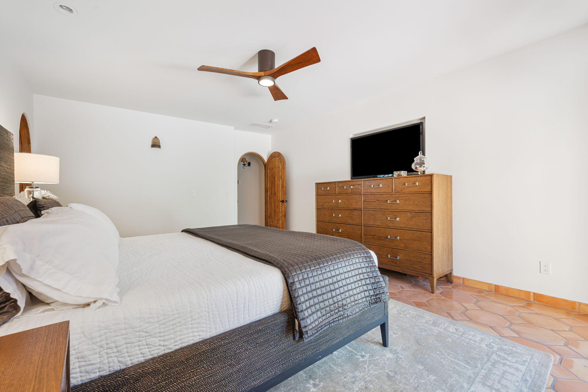 71429 Mirage Road Rancho Mirage, CA 92270 - Photo 60 of 65 a bedroom with a bed and a flat screen tv