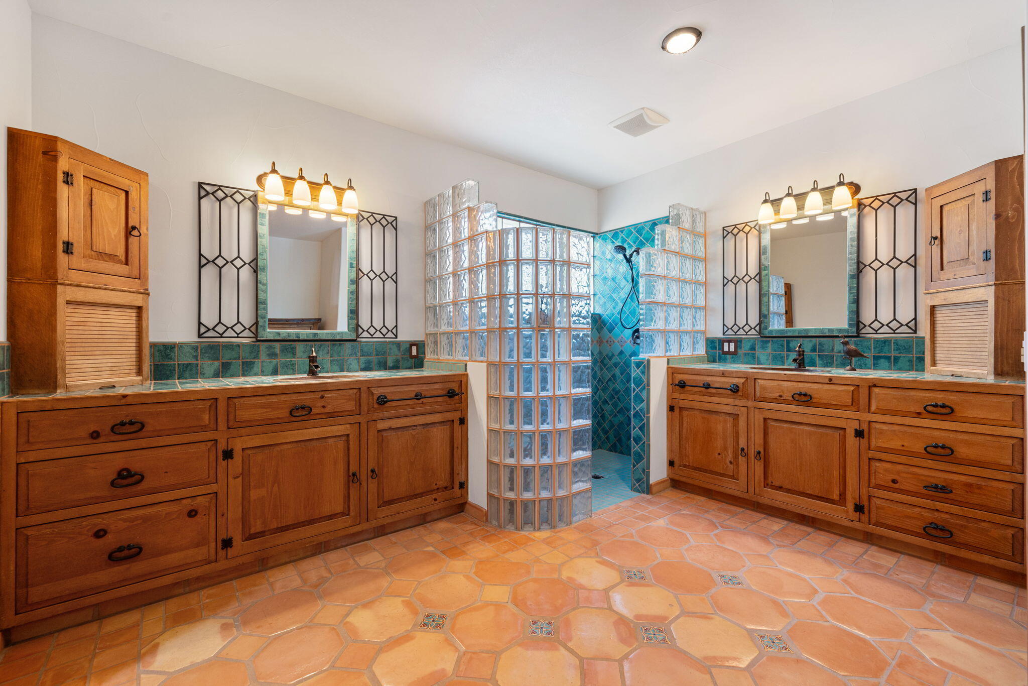71429 Mirage Road Rancho Mirage, CA 92270 - Photo 62 of 65 a spacious bathroom with a double vanity sink and a mirror