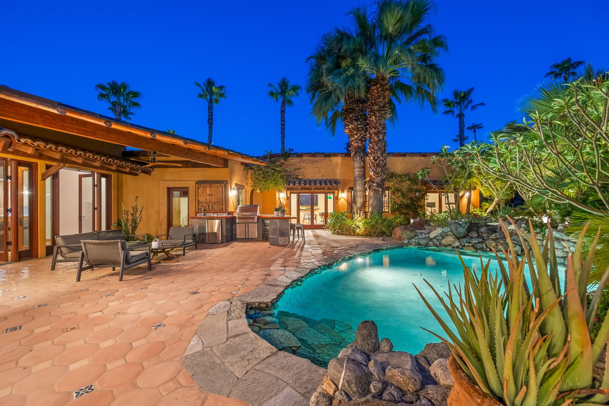 71429 Mirage Road Rancho Mirage, CA 92270 - Photo 8 of 65 a view of a swimming pool with a patio