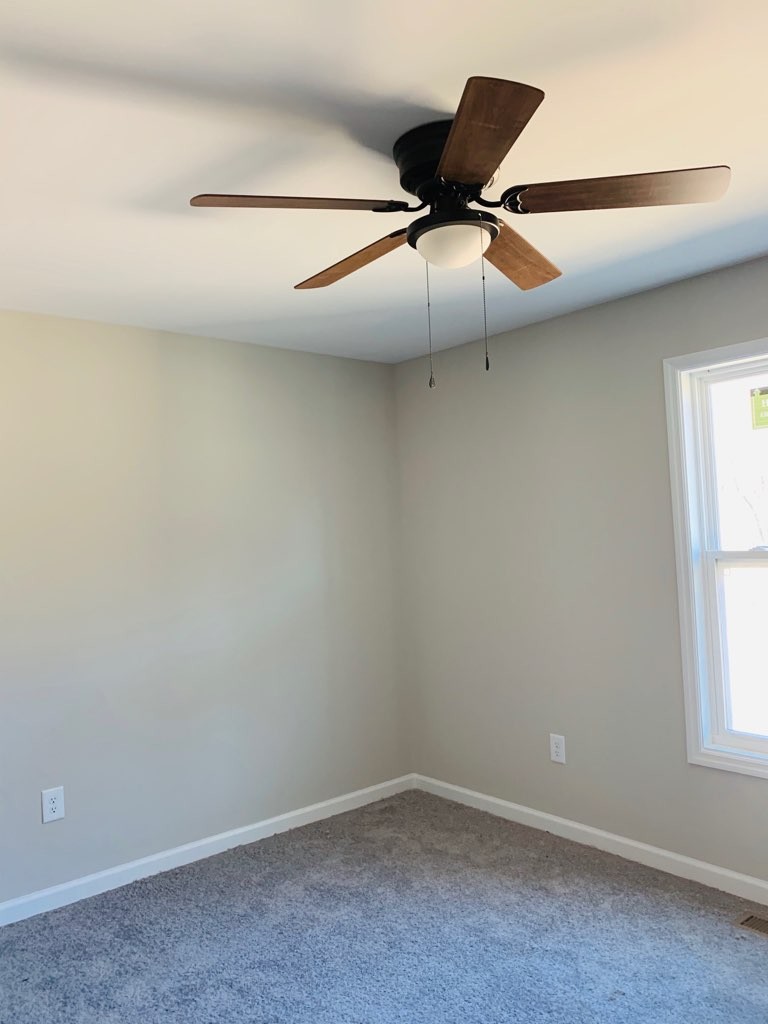 2302 Dry Prong Road Mulberry, TN 37359 - Photo 8 of 10 an empty room with a ceiling fan and window