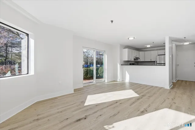 a view of kitchen with wooden floor and window