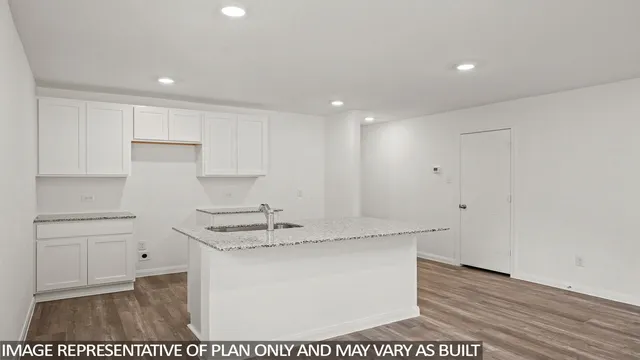 a view of cabinets with wooden floor