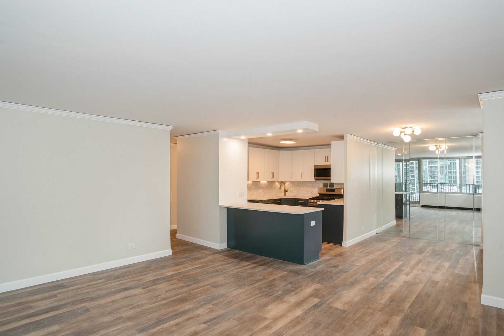 400 East Randolph Street, Unit 1020 Chicago, IL 60601 - Photo 5 of 27 a view of kitchen with wooden floor