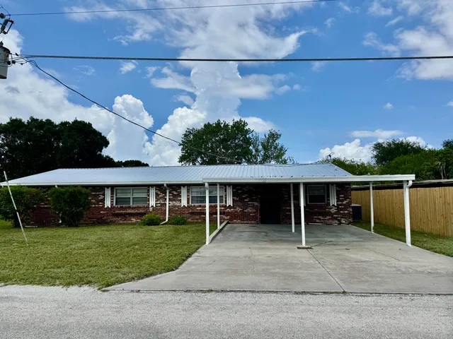 a view of house with outdoor space and yard