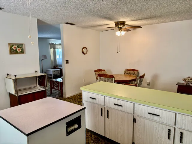 a room with a table and chairs