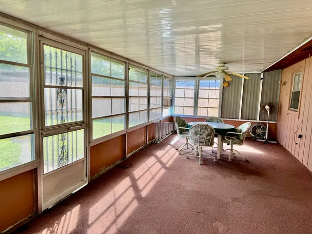 a balcony with furniture and a window