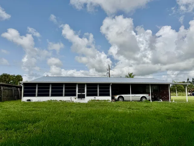 a view of house with yard and front view