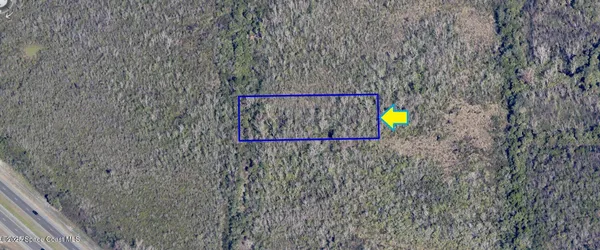 a sign that is on a brick wall