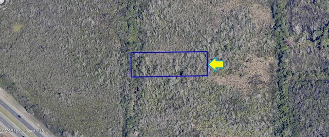 a sign that is on a brick wall