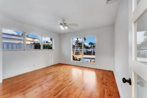 a view of a room with a ceiling fan
