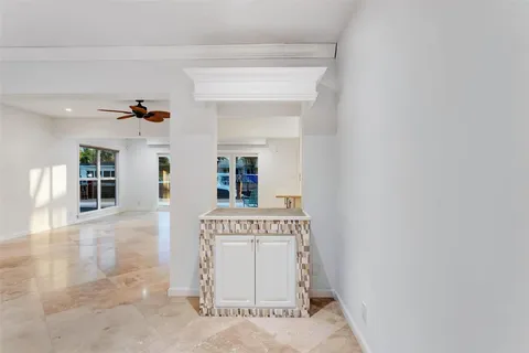 a kitchen with stainless steel appliances granite countertop a stove and a wooden floors
