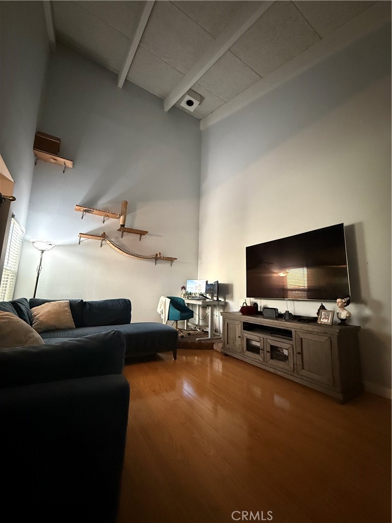 9565 Graham Street Cypress, CA 90630 - Photo 16 of 29 a living room with furniture and a flat screen tv