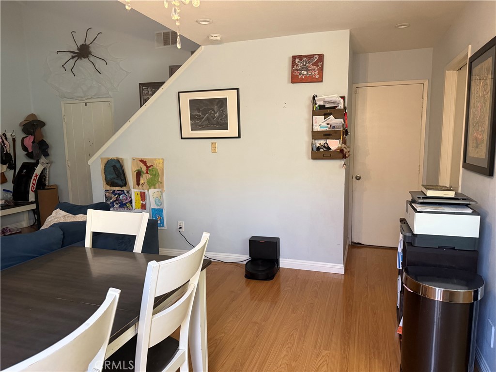9565 Graham Street Cypress, CA 90630 - Photo 17 of 29 a view of a workspace with furniture and wooden floor