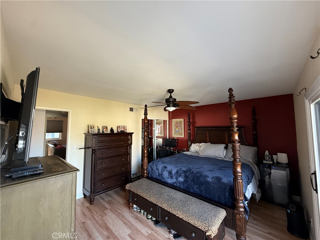 9565 Graham Street Cypress, CA 90630 - Photo 10 of 29 a bedroom with a bed and furniture