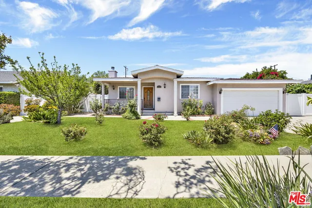 a view of a house with a garden