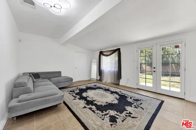 a living room with furniture and a rug