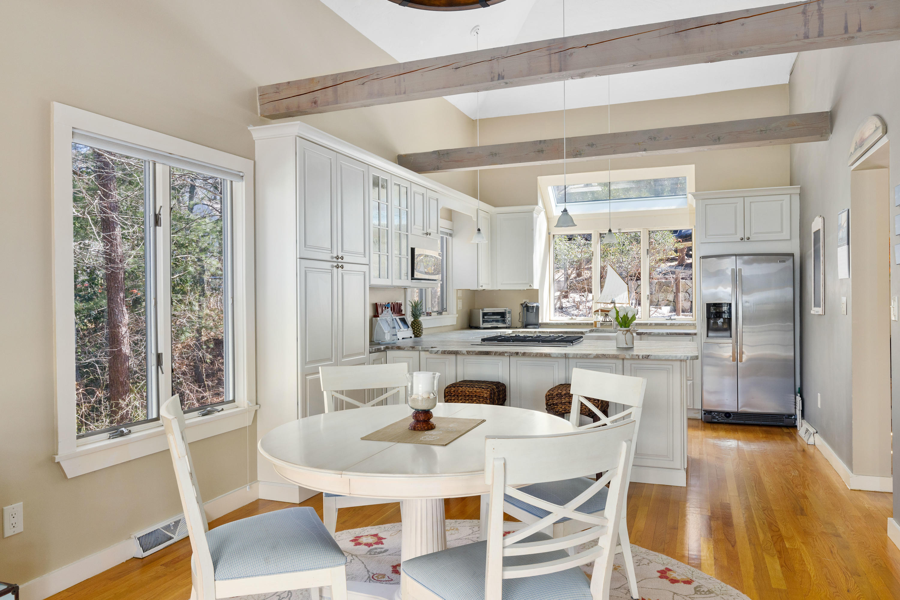 56 Summersea Road Mashpee, MA 02649 - Photo 7 of 44 a dining room with stainless steel appliances granite countertop a table and chairs