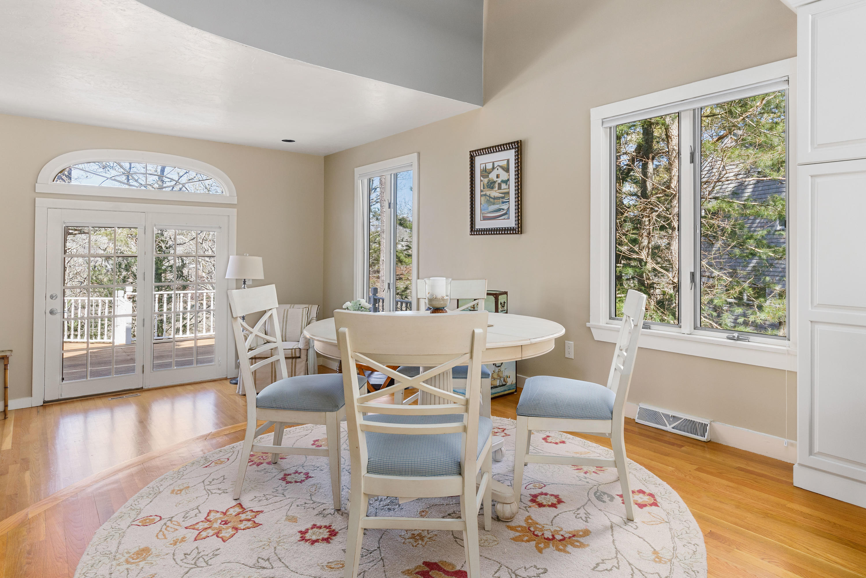 56 Summersea Road Mashpee, MA 02649 - Photo 8 of 44 a dining room with wooden floor and a table