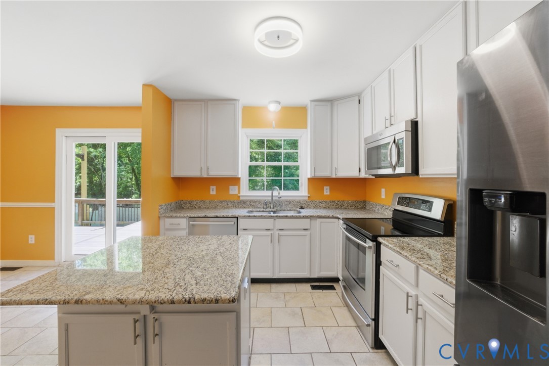 2512 Brookforest Road Midlothian, VA 23112 - Photo 14 of 40 Kitchen featuring white cabinetry, granite counter