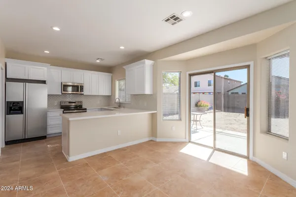 a large kitchen with cabinets