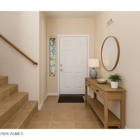 a living room with furniture a mirror and a wooden floor