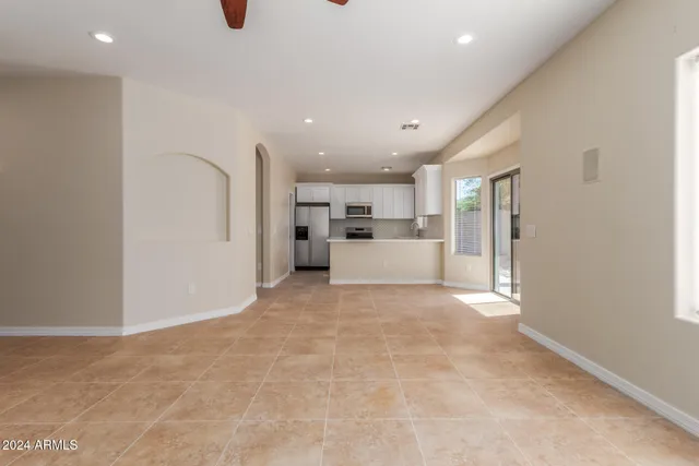 a view of a kitchen with a sink and a window