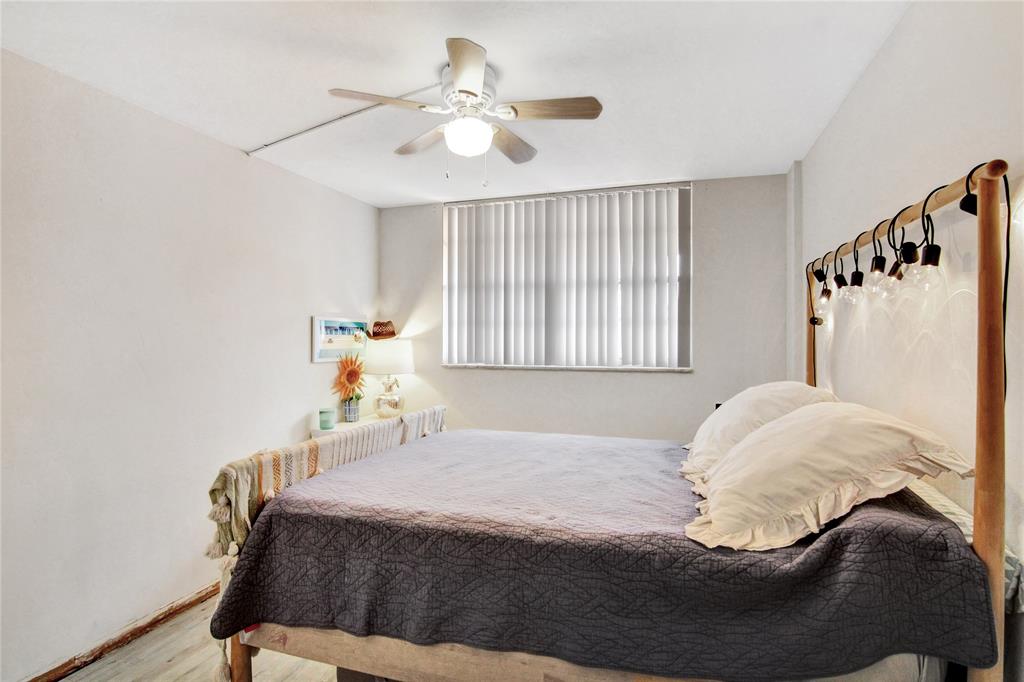 4500 North Federal Highway, Unit 158G Lighthouse Point, FL 33064 - Photo 13 of 36 a bedroom with a bed and window