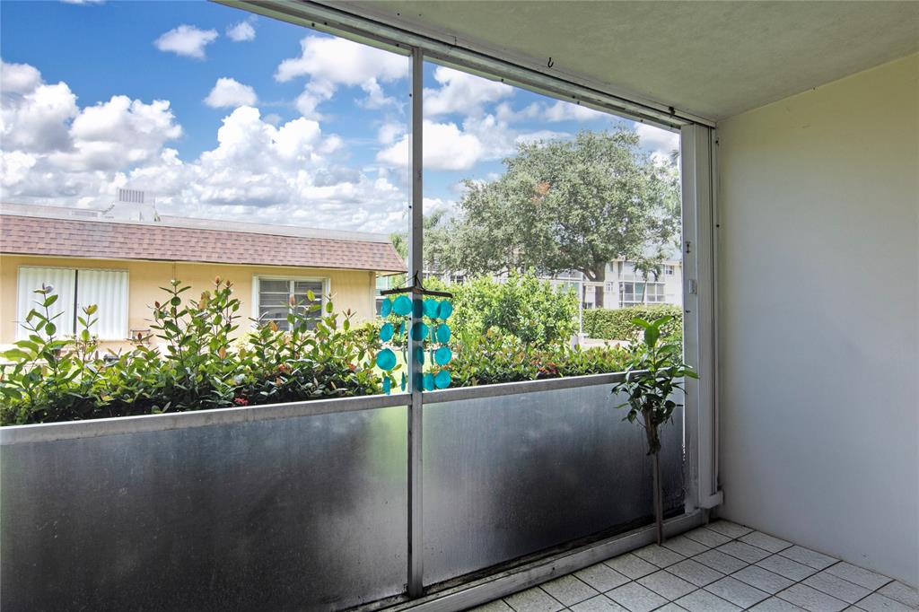 4500 North Federal Highway, Unit 158G Lighthouse Point, FL 33064 - Photo 16 of 36 a potted plant sitting in front of a window