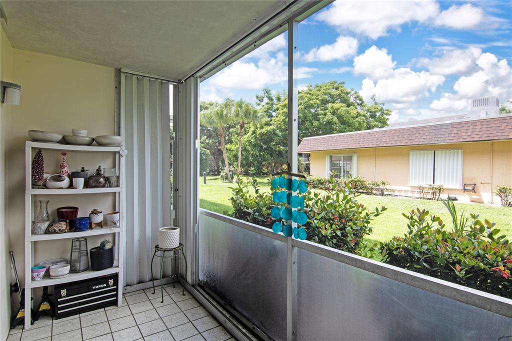4500 North Federal Highway, Unit 158G Lighthouse Point, FL 33064 - Photo 17 of 36 a view of a balcony with lots of potted plants