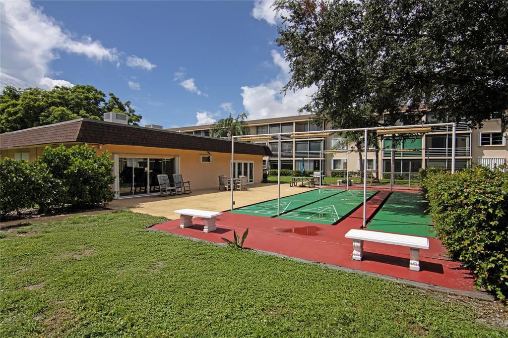 4500 North Federal Highway, Unit 158G Lighthouse Point, FL 33064 - Photo 23 of 36 a view of a house with a yard porch and sitting area