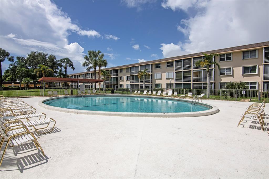 4500 North Federal Highway, Unit 158G Lighthouse Point, FL 33064 - Photo 26 of 36 a view of a house with swimming pool and sitting area