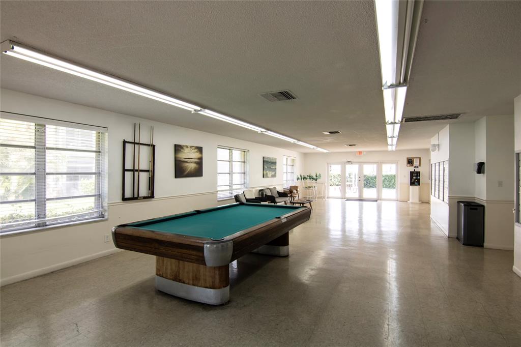4500 North Federal Highway, Unit 158G Lighthouse Point, FL 33064 - Photo 28 of 36 a living room with furniture and flat screen tv