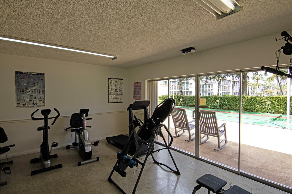 4500 North Federal Highway, Unit 158G Lighthouse Point, FL 33064 - Photo 32 of 36 a view of a room with gym equipment