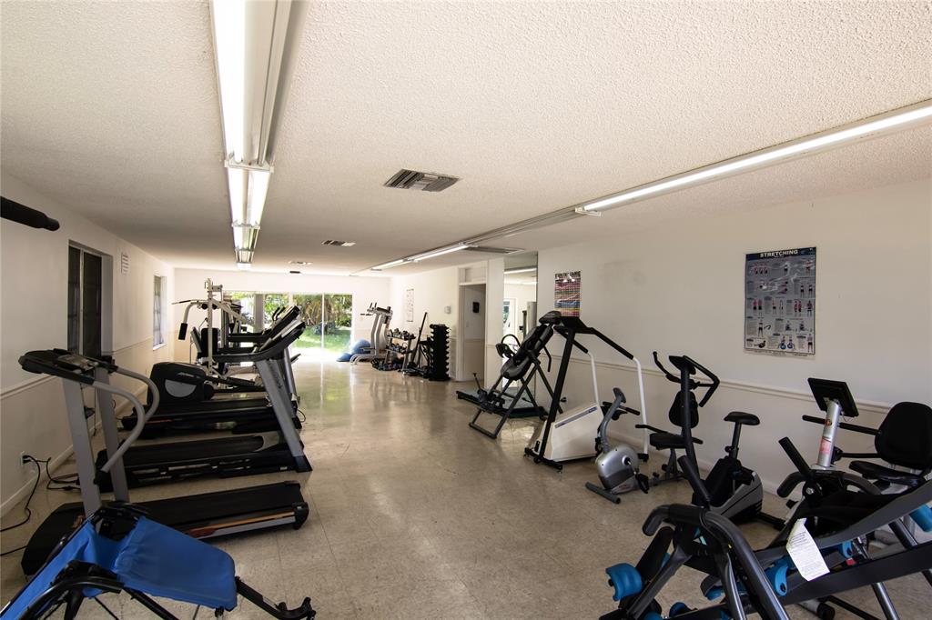 4500 North Federal Highway, Unit 158G Lighthouse Point, FL 33064 - Photo 33 of 36 a view of a room with gym equipment